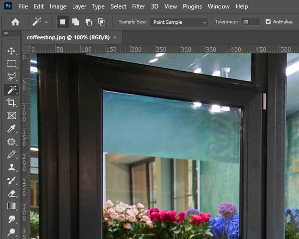 A flower-filled window framed by a rustic window frame, showcasing the beauty of a flower shop in Photoshop.